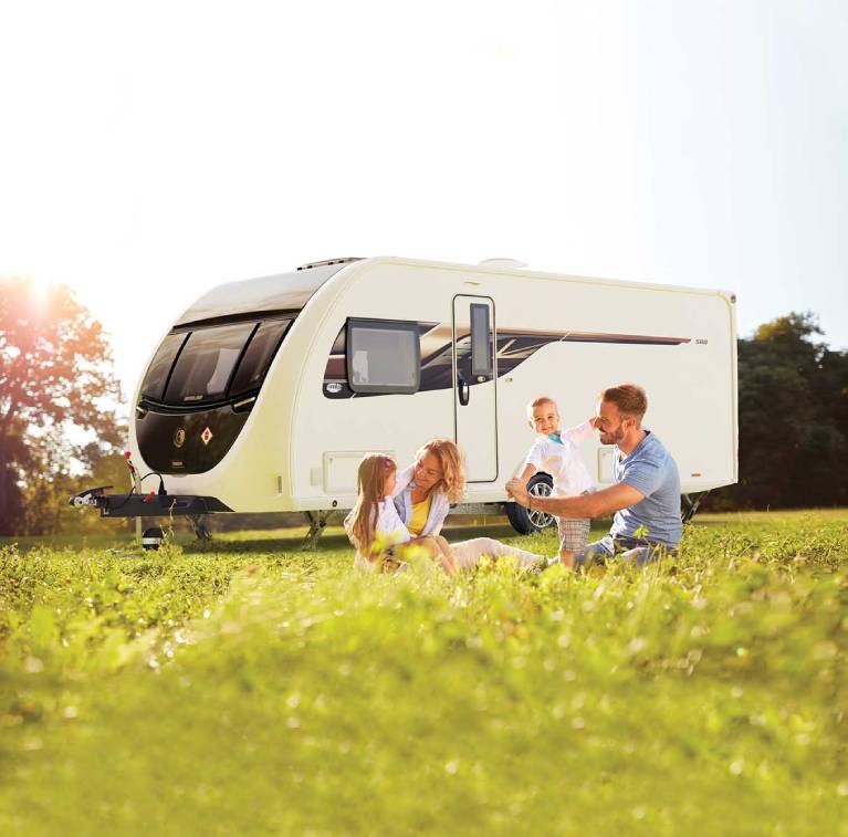 Family enjoying a UK staycation in their caravan